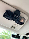 Car sun visor, glasses clip, bow tie with rhinestones